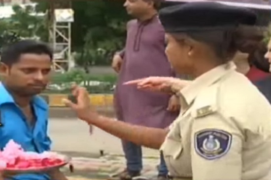 lady traffic police applying tilak